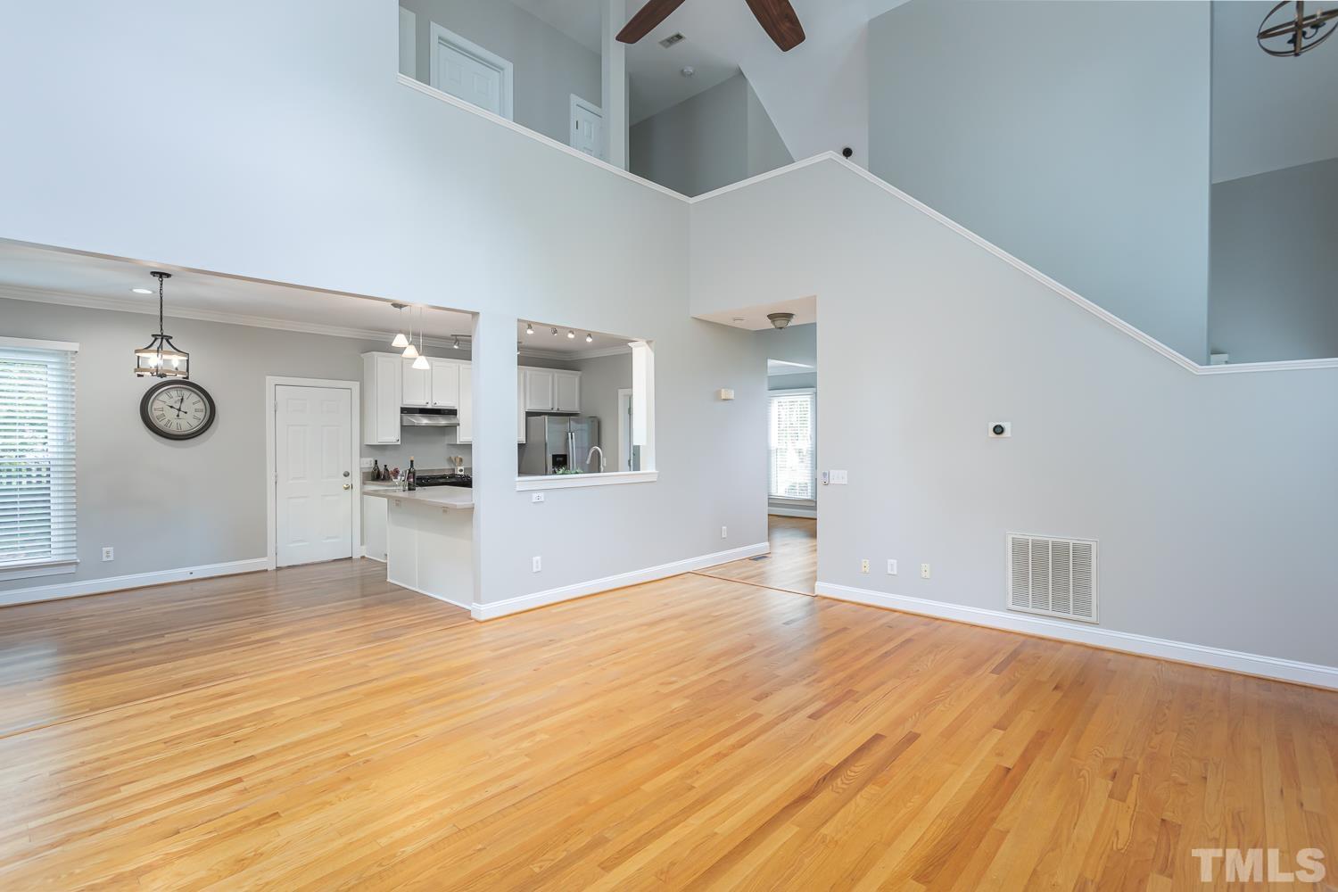 5304 Back Sail Court Raleigh, NC 27613 - Photo 10 of 22 a view of a kitchen with wooden floor and a sink