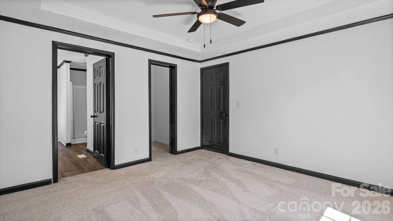175 Fallsworth Court Salisbury, NC 28147 - Photo 22 of 35 a view of a hallway with a chandelier fan