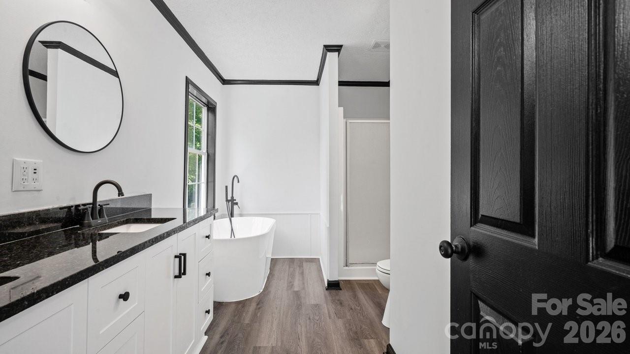 175 Fallsworth Court Salisbury, NC 28147 - Photo 23 of 35 a bathroom with a double vanity sink and a mirror