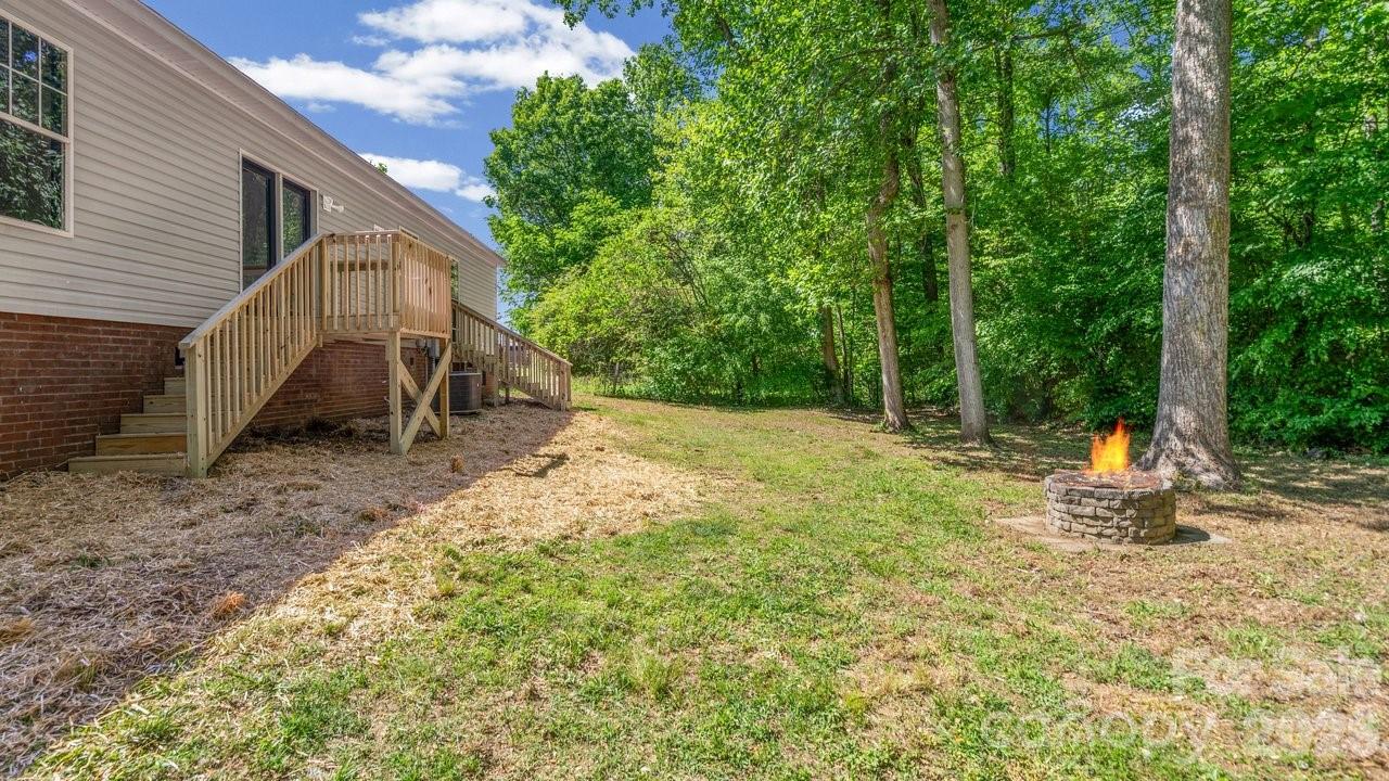 175 Fallsworth Court Salisbury, NC 28147 - Photo 34 of 35 a backyard of a house with table and chairs