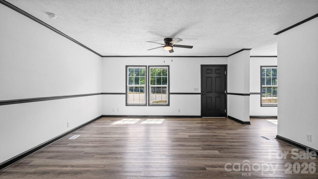 175 Fallsworth Court Salisbury, NC 28147 - Photo 7 of 35 a view of an empty room with a window and wooden floor