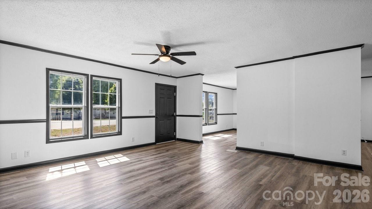 175 Fallsworth Court Salisbury, NC 28147 - Photo 9 of 35 a view of empty room with wooden floor and fan