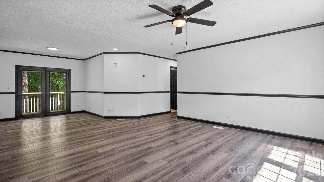 175 Fallsworth Court Salisbury, NC 28147 - Photo 10 of 35 a view of a big room with wooden floor and a window