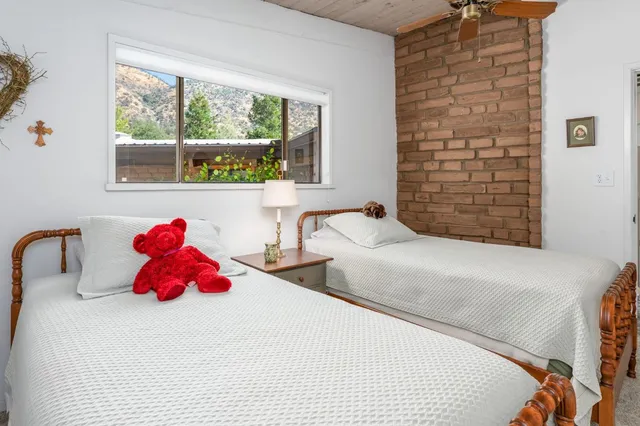 a bathroom with a toilet a sink and a mirror