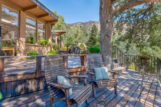 an aerial view of a house with yard swimming pool and outdoor seating