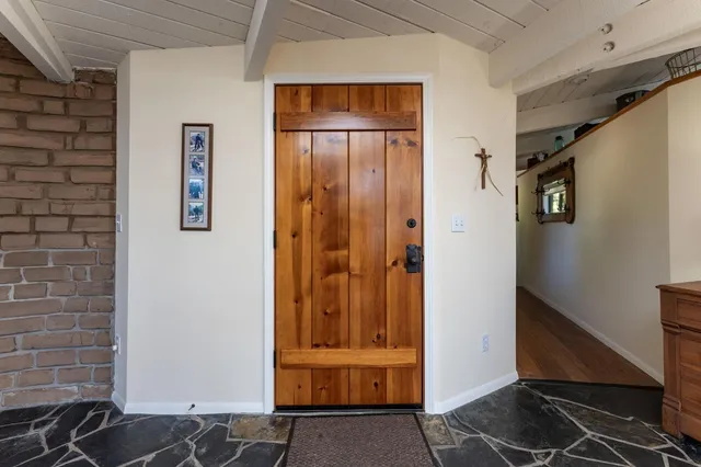 a living room with furniture a fireplace and a table