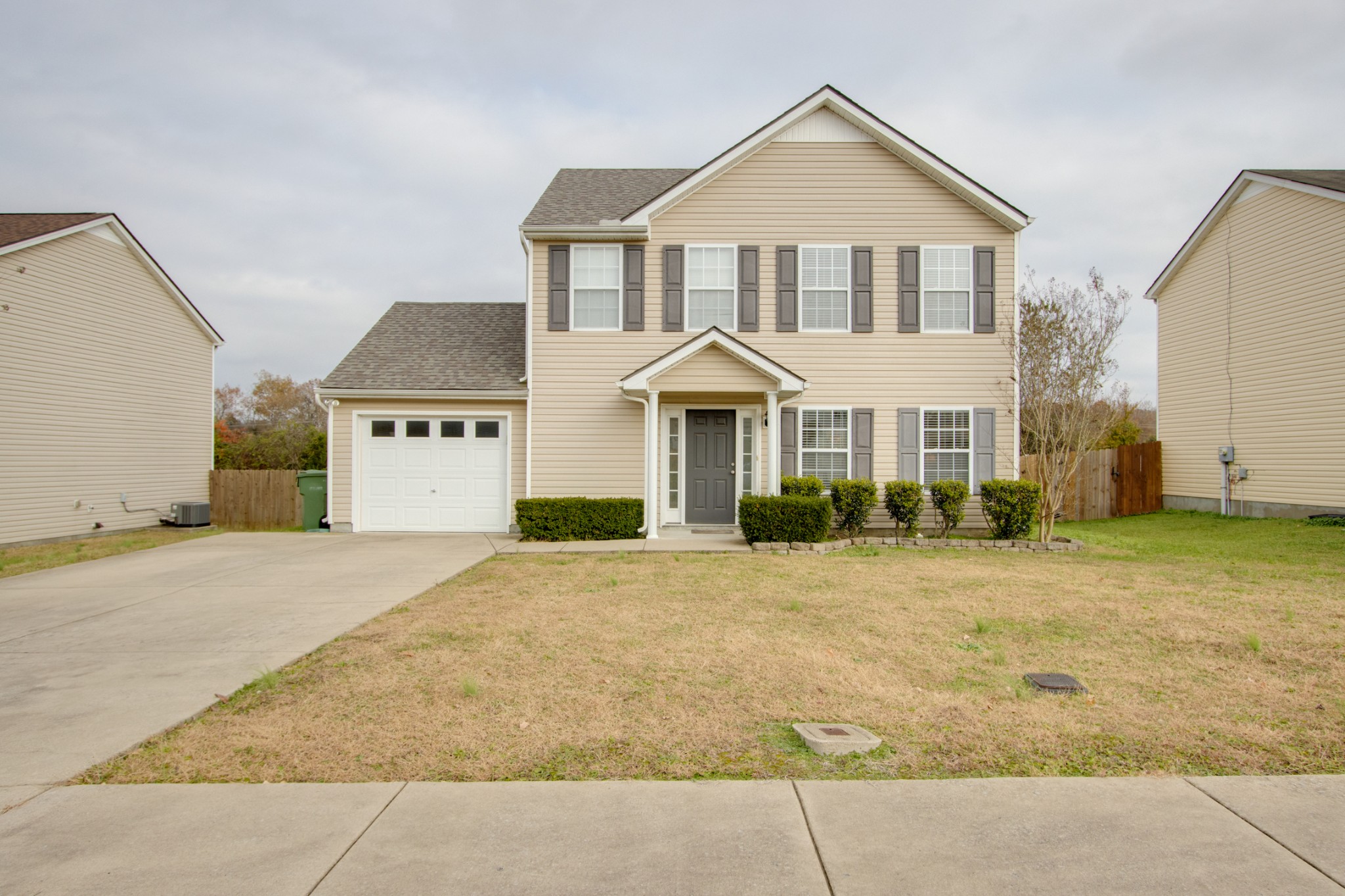 977 Woodall Road Lebanon, TN 37090 - Photo 1 of 32 a front view of a house with a yard and garage