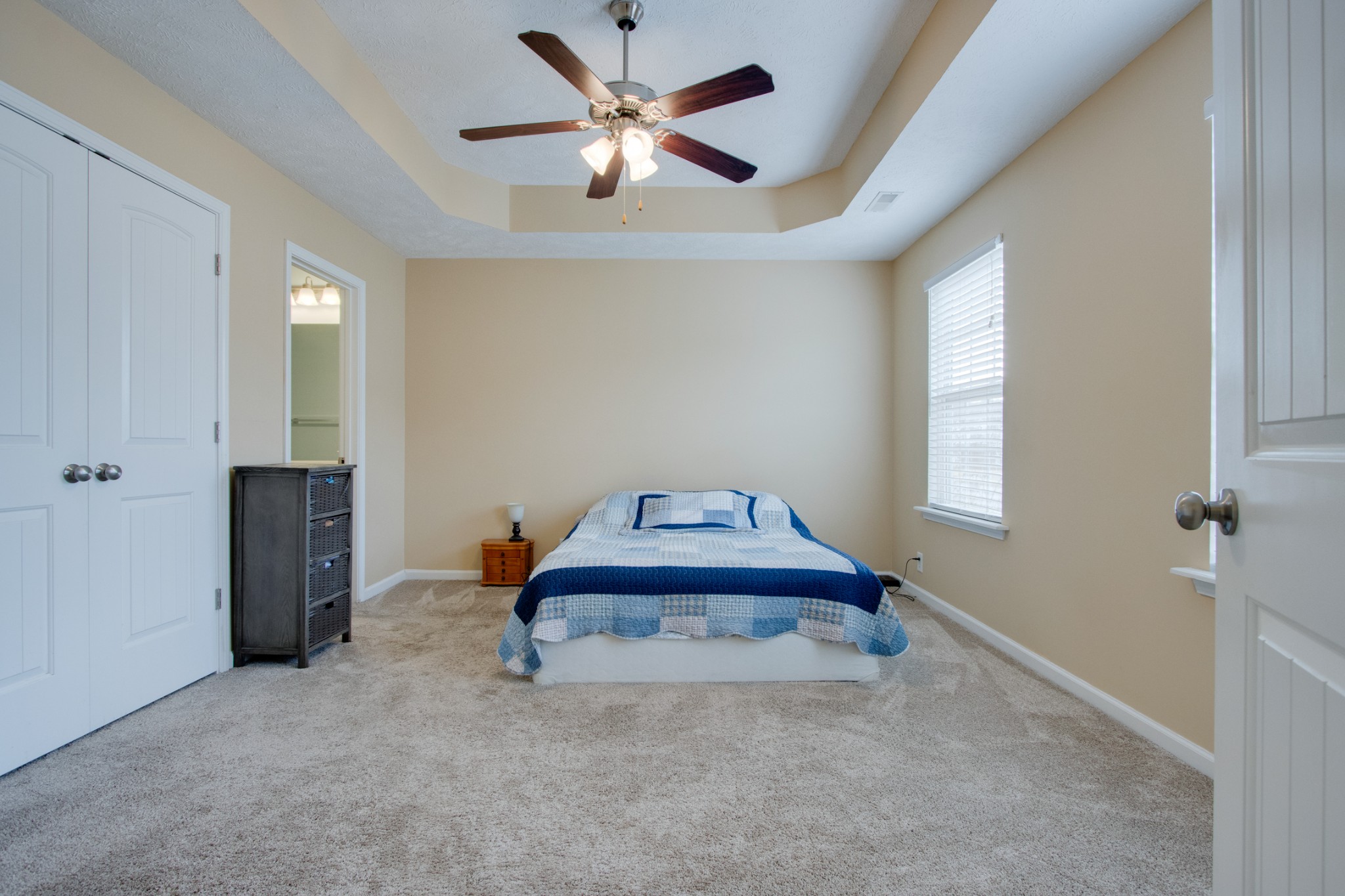 977 Woodall Road Lebanon, TN 37090 - Photo 19 of 32 a bedroom with a bed and a chandelier