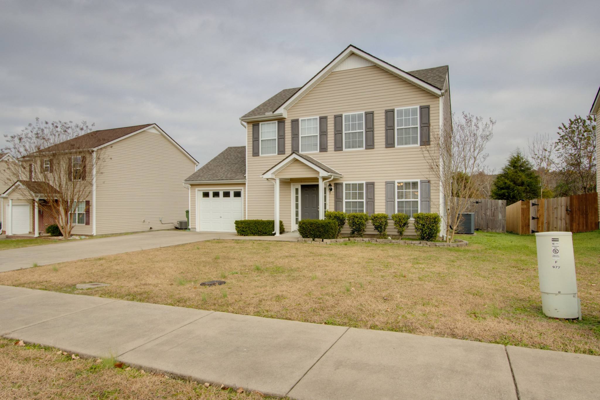977 Woodall Road Lebanon, TN 37090 - Photo 2 of 32 a view of a big house with a yard and plants