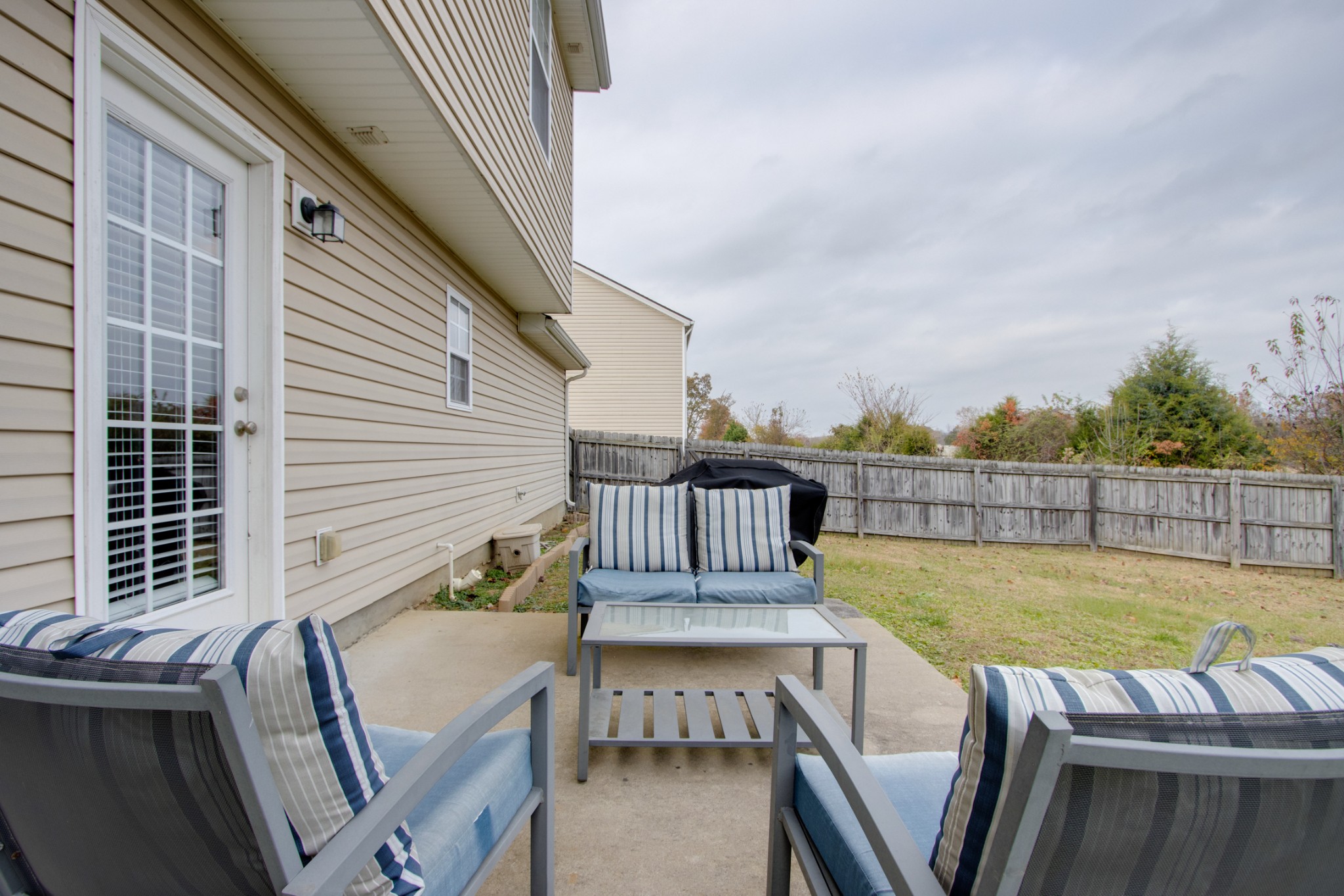 977 Woodall Road Lebanon, TN 37090 - Photo 30 of 32 a view of a balcony with two chairs and a table