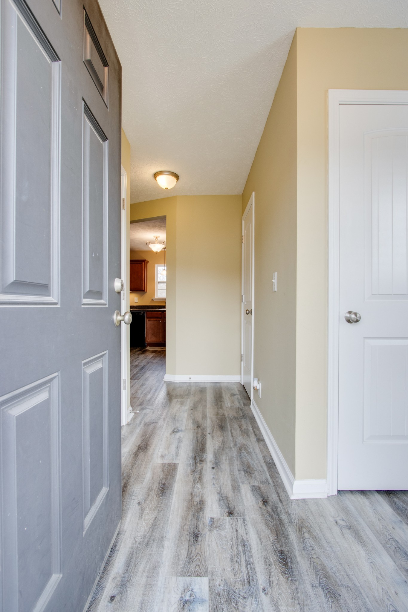 977 Woodall Road Lebanon, TN 37090 - Photo 3 of 32 a view of a hallway with wooden floor and a bathroom