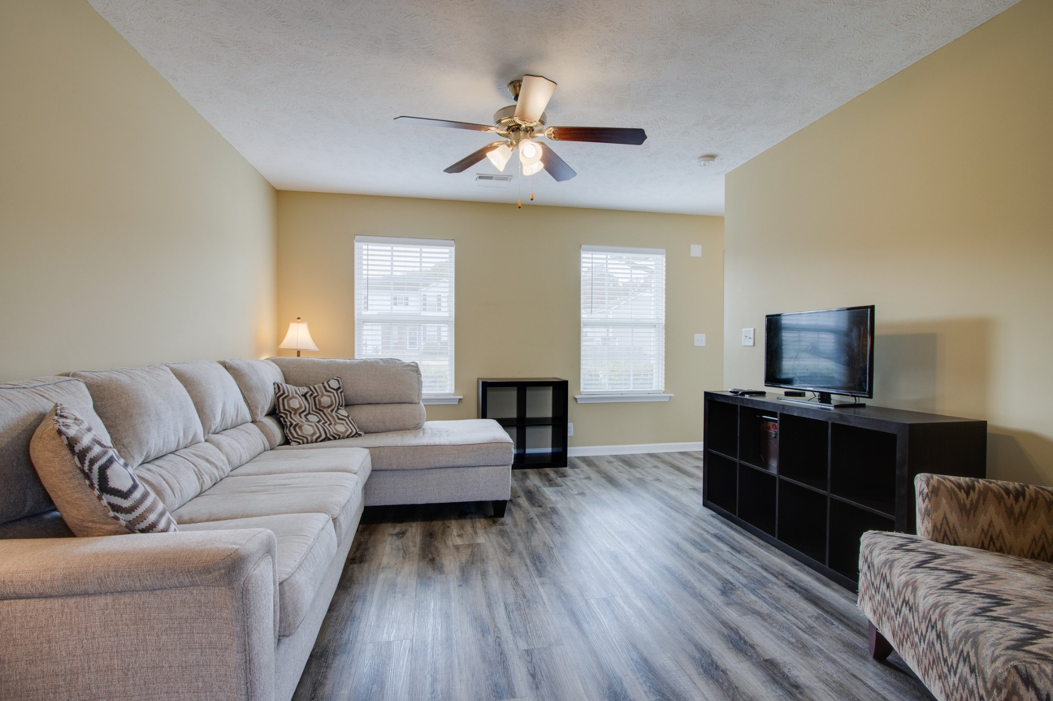 977 Woodall Road Lebanon, TN 37090 - Photo 8 of 32 a living room with furniture and a flat screen tv