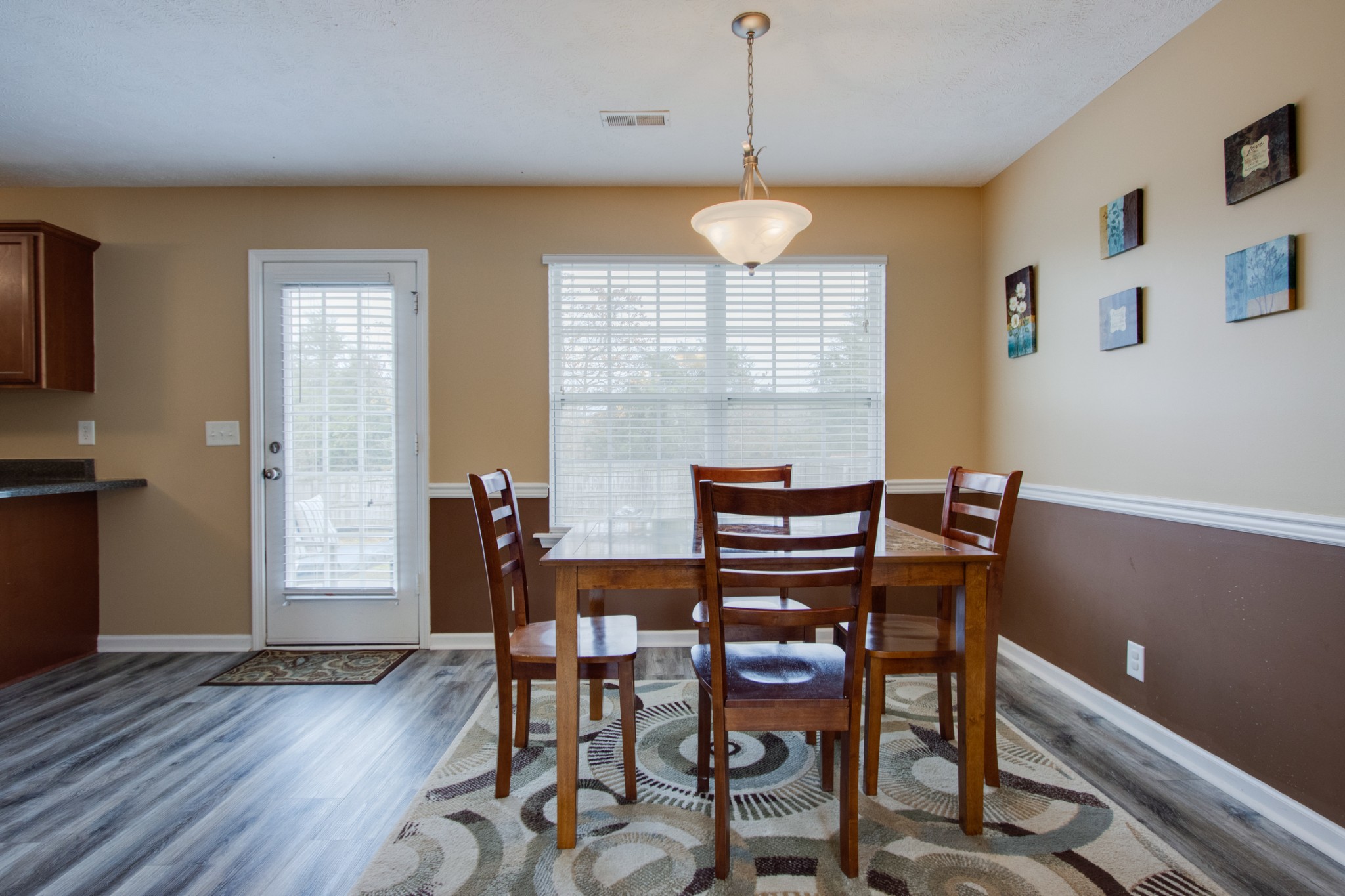 977 Woodall Road Lebanon, TN 37090 - Photo 9 of 32 a view of a dining room with furniture window and wooden floor