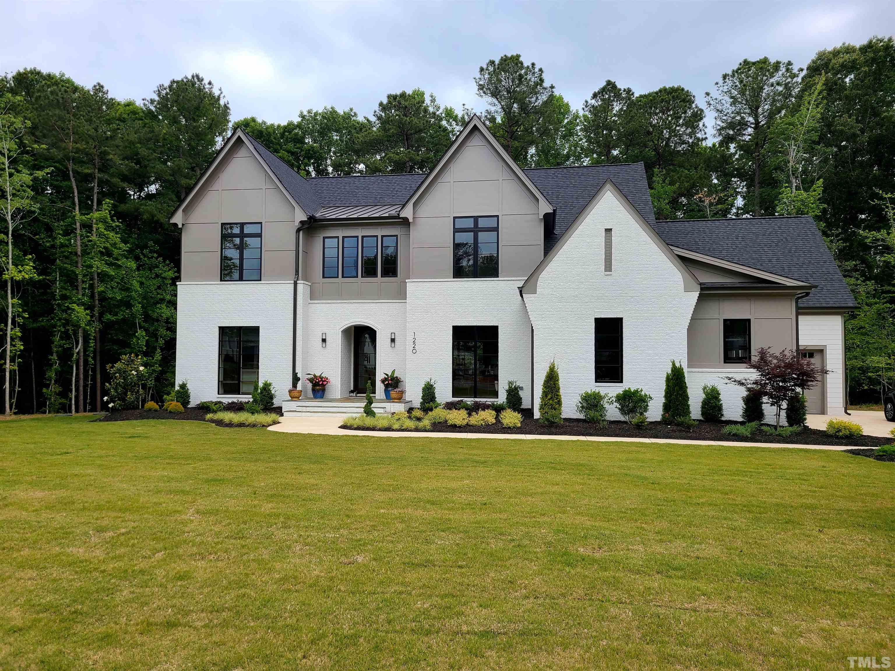 1220 Explorer Trail Wake Forest, NC 27587 - Photo 1 of 49 a front view of a house with a yard