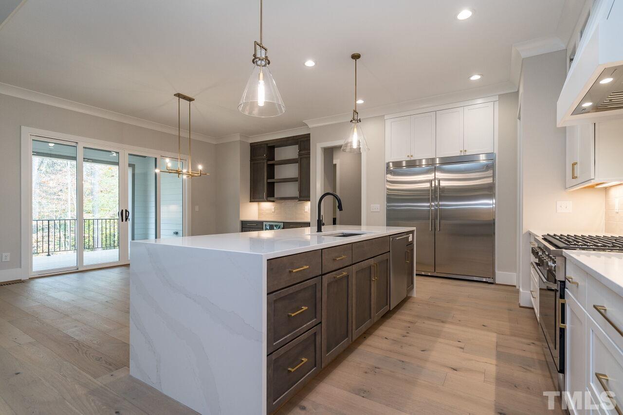 1220 Explorer Trail Wake Forest, NC 27587 - Photo 15 of 49 a large kitchen with a large counter top appliances and cabinets