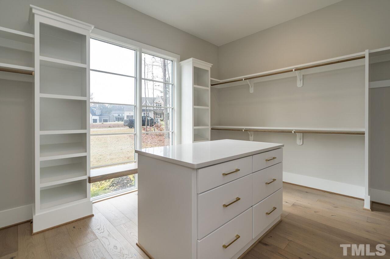 1220 Explorer Trail Wake Forest, NC 27587 - Photo 27 of 49 a room with cabinets and a window