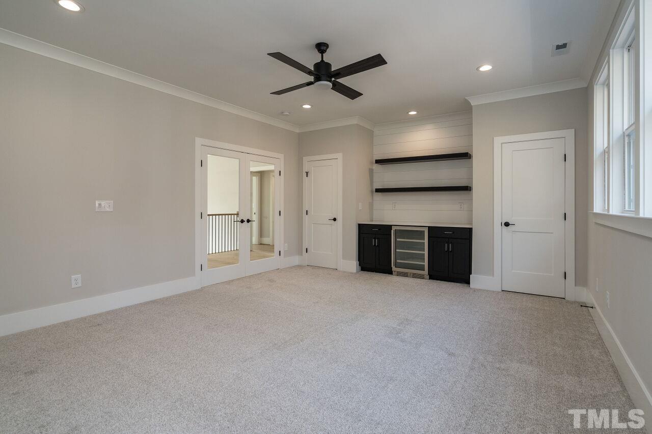 1220 Explorer Trail Wake Forest, NC 27587 - Photo 35 of 49 an empty room with a ceiling fan and entryway