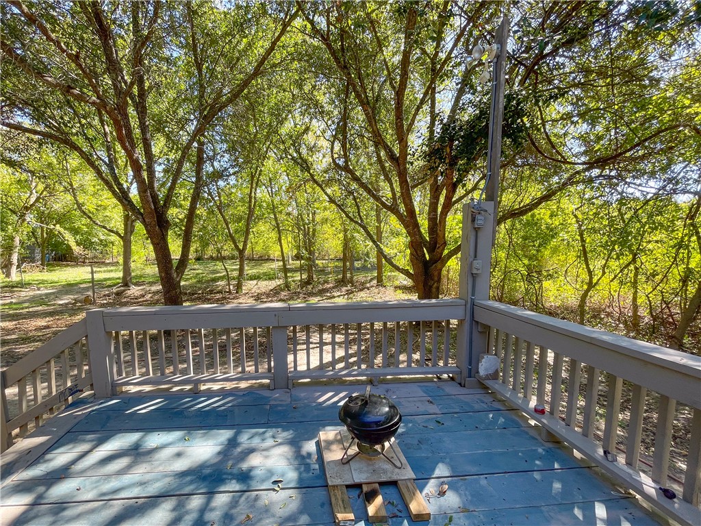 738 Commerce Street Bryan, TX 77803 - Photo 13 of 15 a view of a roof deck with wooden floor and fence