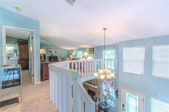 a dining room with furniture entryway and wooden floor