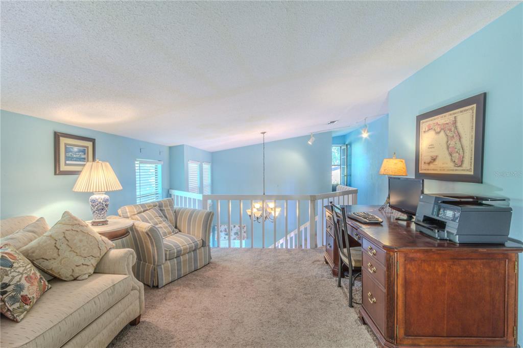 39 Cherokee Trail Ormond Beach, FL 32174 - Photo 17 of 35 a living room with furniture a lamp and a window