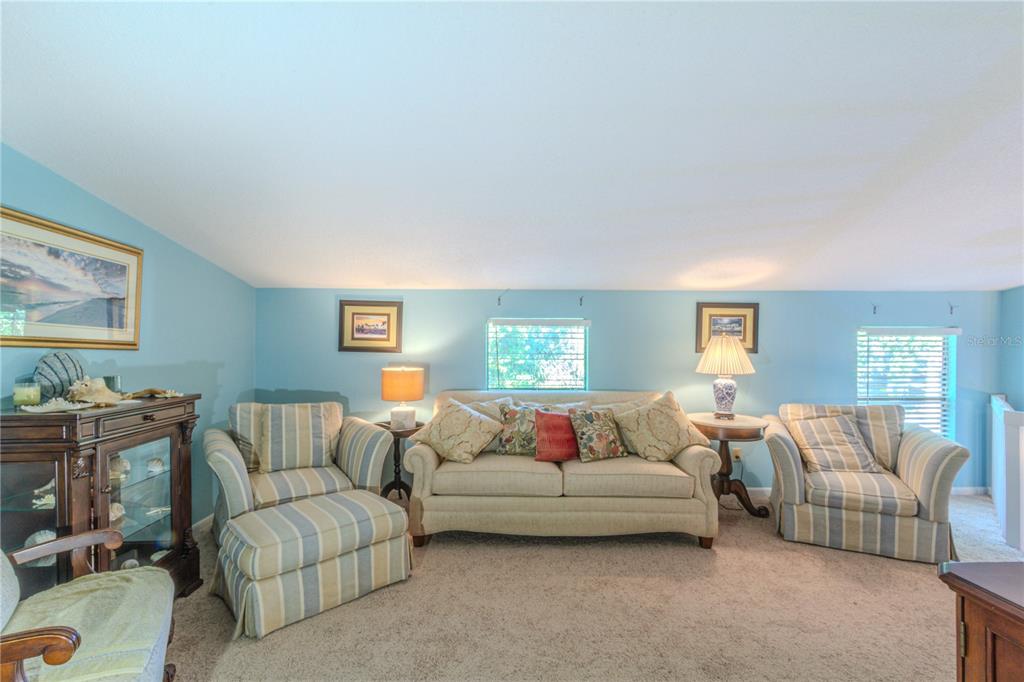39 Cherokee Trail Ormond Beach, FL 32174 - Photo 18 of 35 a living room with furniture and a couch