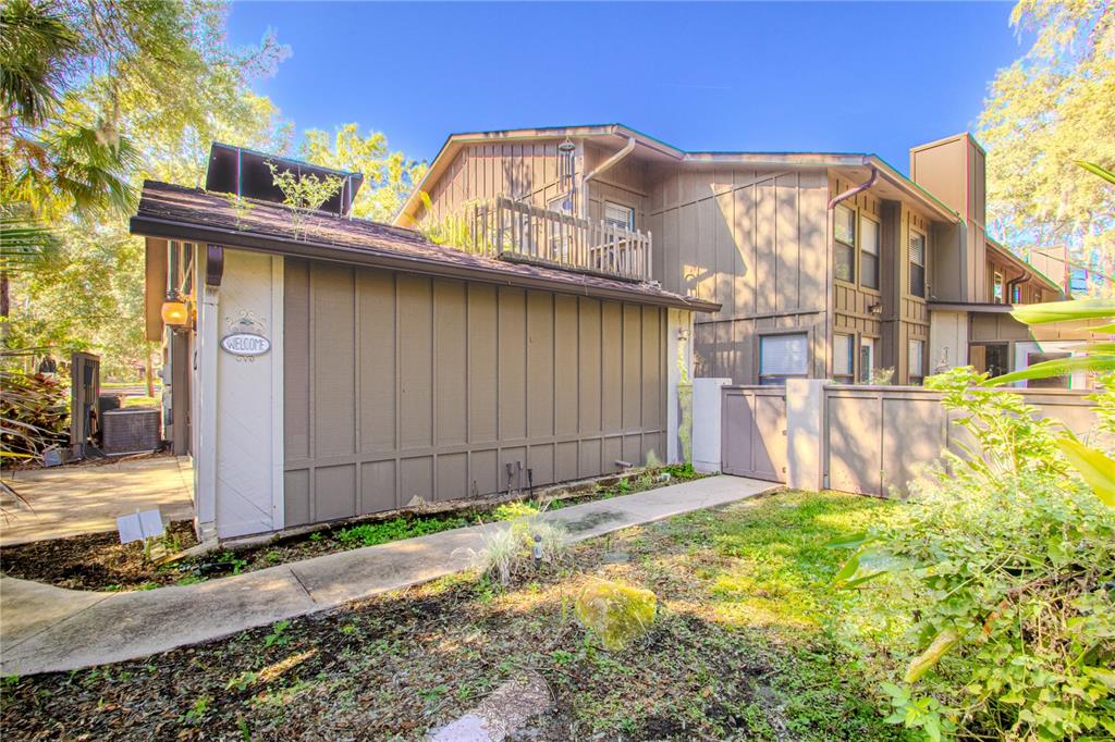 39 Cherokee Trail Ormond Beach, FL 32174 - Photo 2 of 35 a view of a house with a small yard and wooden fence