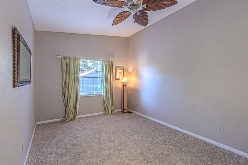 39 Cherokee Trail Ormond Beach, FL 32174 - Photo 28 of 35 an empty room with windows and fan