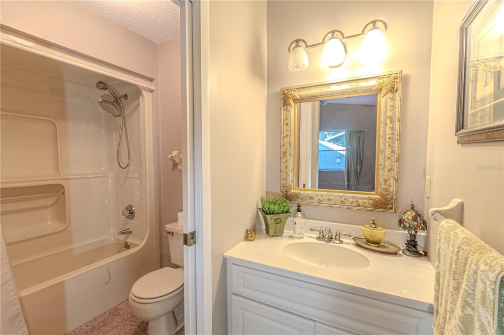 39 Cherokee Trail Ormond Beach, FL 32174 - Photo 29 of 35 a bathroom with a granite countertop sink toilet and shower