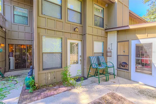 a building with glass door and outdoor space