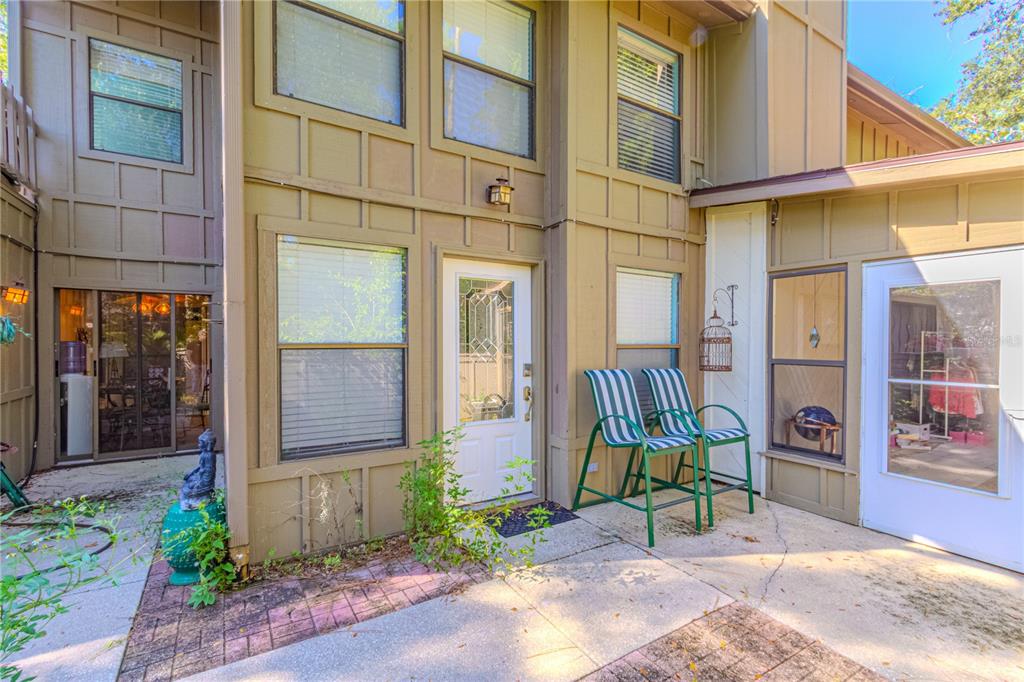 39 Cherokee Trail Ormond Beach, FL 32174 - Photo 3 of 35 a building with glass door and outdoor space