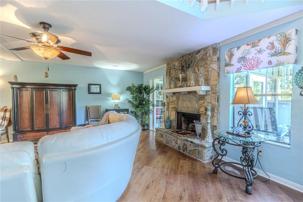 39 Cherokee Trail Ormond Beach, FL 32174 - Photo 7 of 35 a living room with furniture and a fireplace