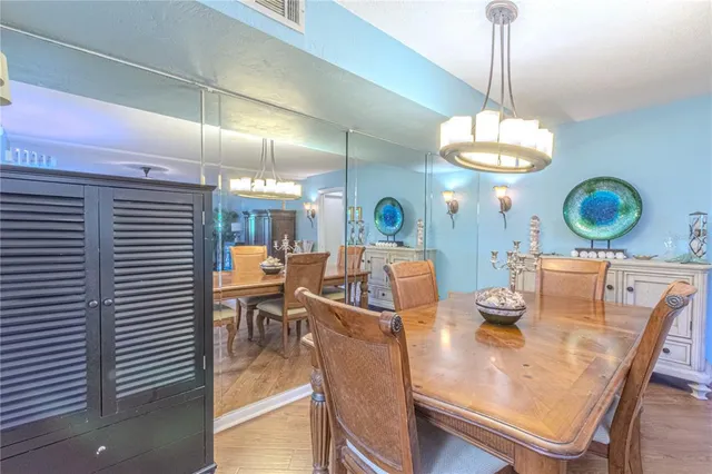 a very nice looking dining room with a table and chairs