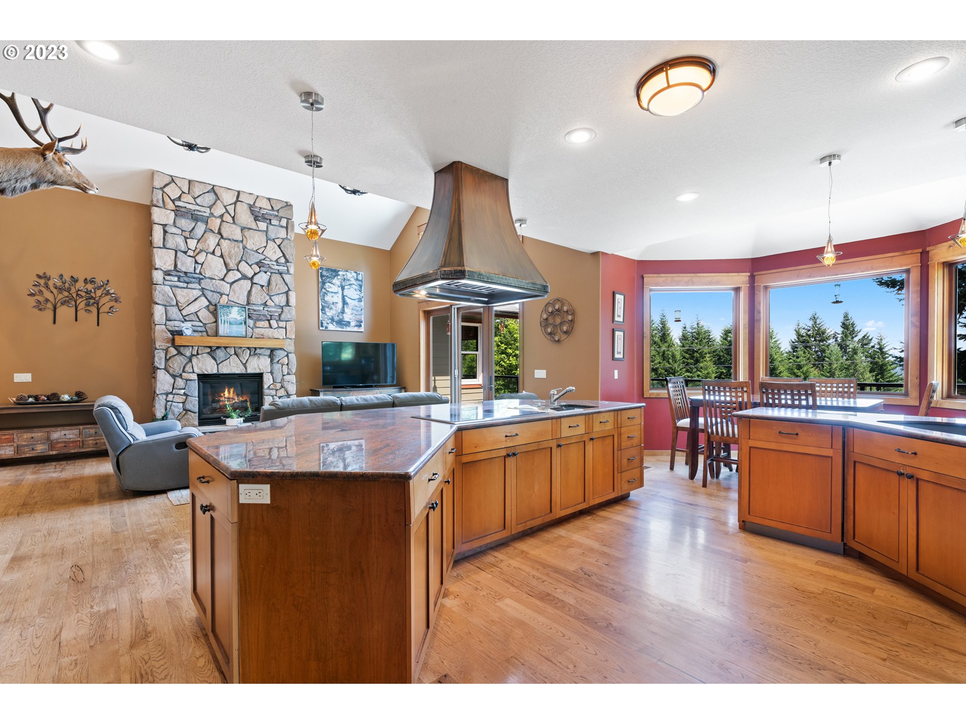 10534 Southeast Vradenburg Road Happy Valley, OR 97086 - Photo 15 of 39 a kitchen with stainless steel appliances granite countertop a stove and cabinets