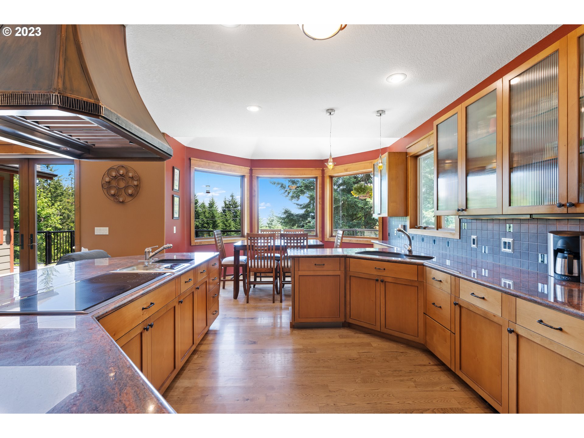 10534 Southeast Vradenburg Road Happy Valley, OR 97086 - Photo 16 of 39 a open kitchen with stainless steel appliances granite countertop sink stove dining table and chairs