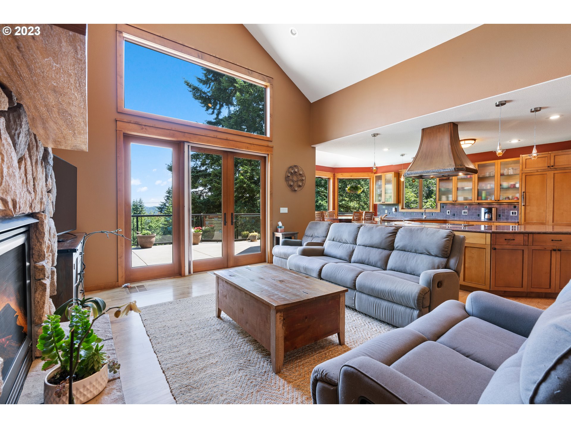 10534 Southeast Vradenburg Road Happy Valley, OR 97086 - Photo 24 of 39 a living room with furniture kitchen view and a large window