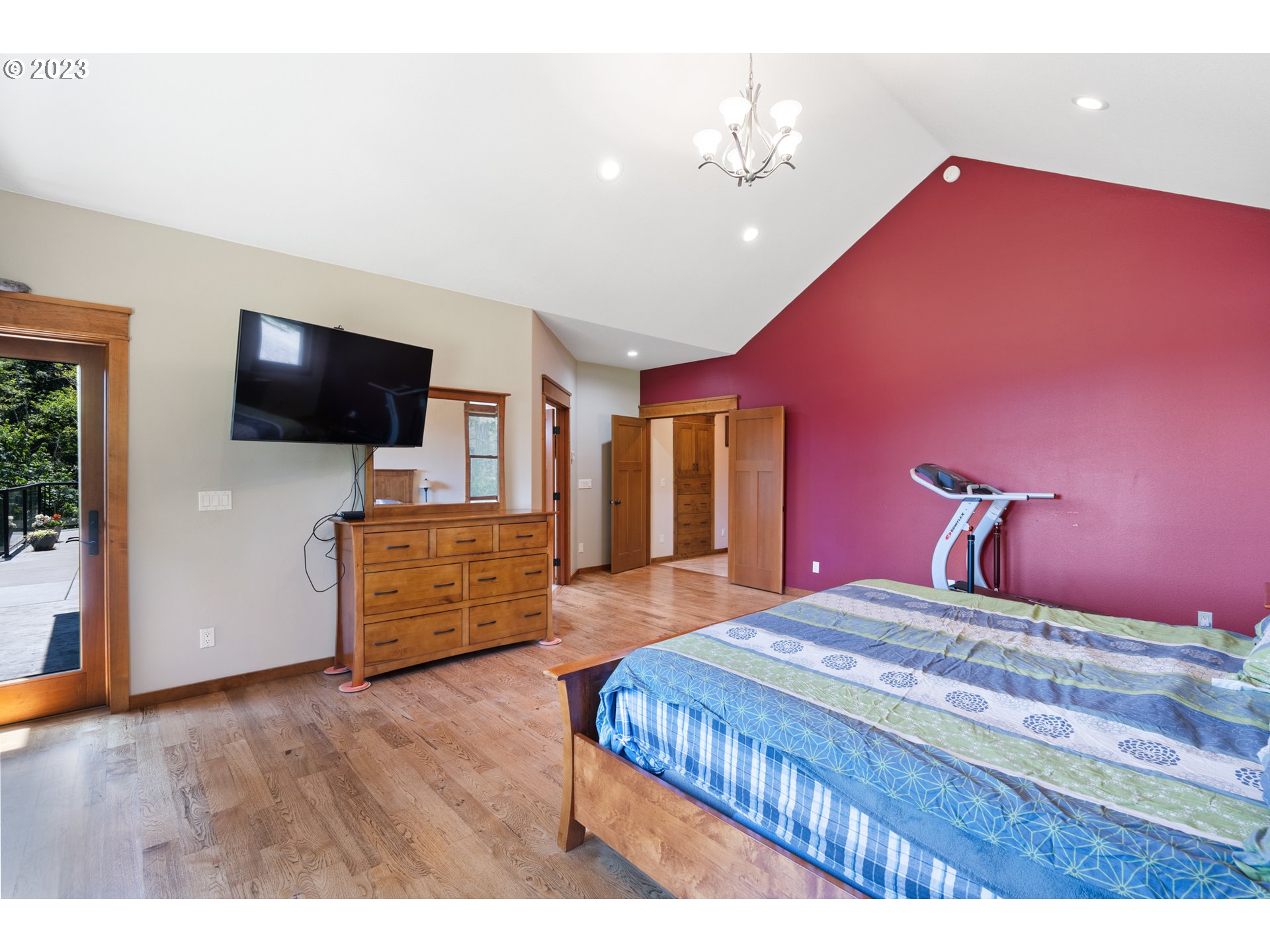 10534 Southeast Vradenburg Road Happy Valley, OR 97086 - Photo 25 of 39 a bedroom with a bed and flat screen tv