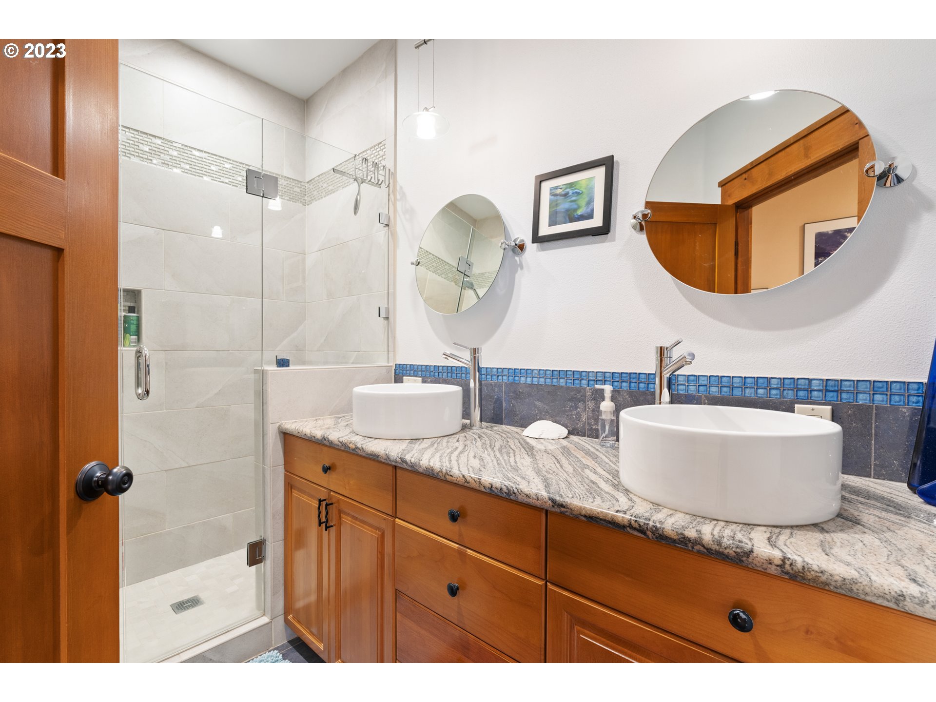10534 Southeast Vradenburg Road Happy Valley, OR 97086 - Photo 26 of 39 a bathroom with a granite countertop sink mirror and vanity