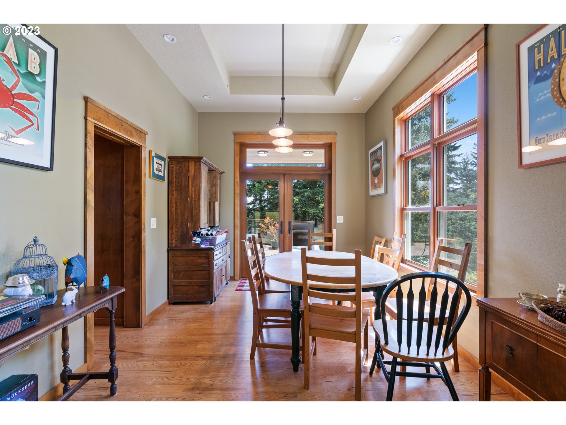 10534 Southeast Vradenburg Road Happy Valley, OR 97086 - Photo 10 of 39 a dining room with furniture a chandelier and window