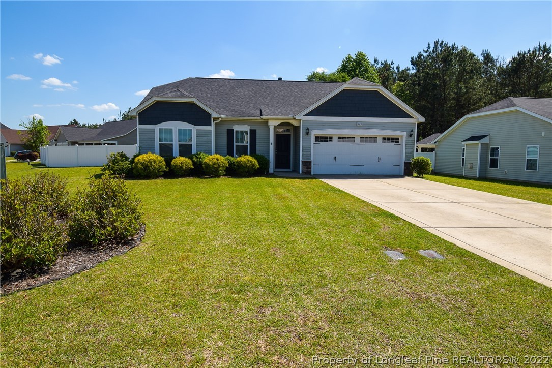 a front view of a house with yard