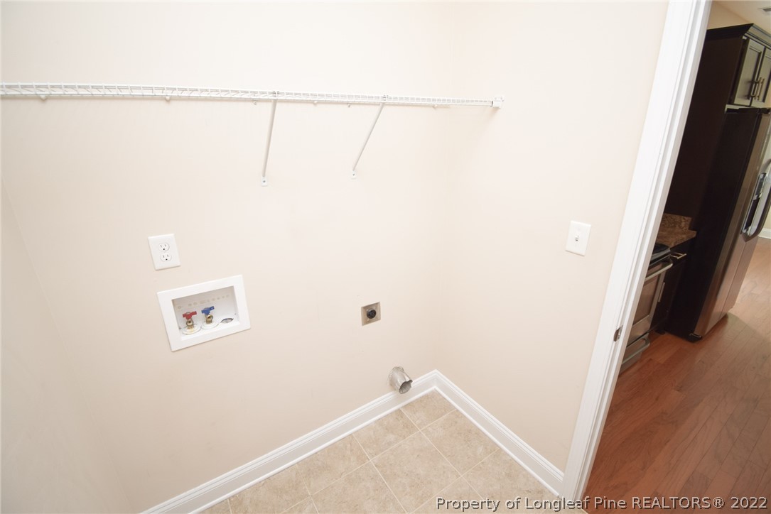 115 Snipe Court Raeford, NC 28376 - Photo 16 of 37 a view of a room with racks on the wall