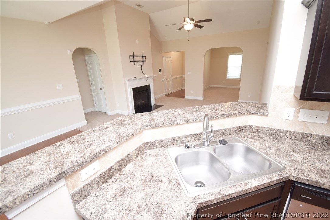 115 Snipe Court Raeford, NC 28376 - Photo 19 of 37 a bathroom with a sink granite tub and a mirror