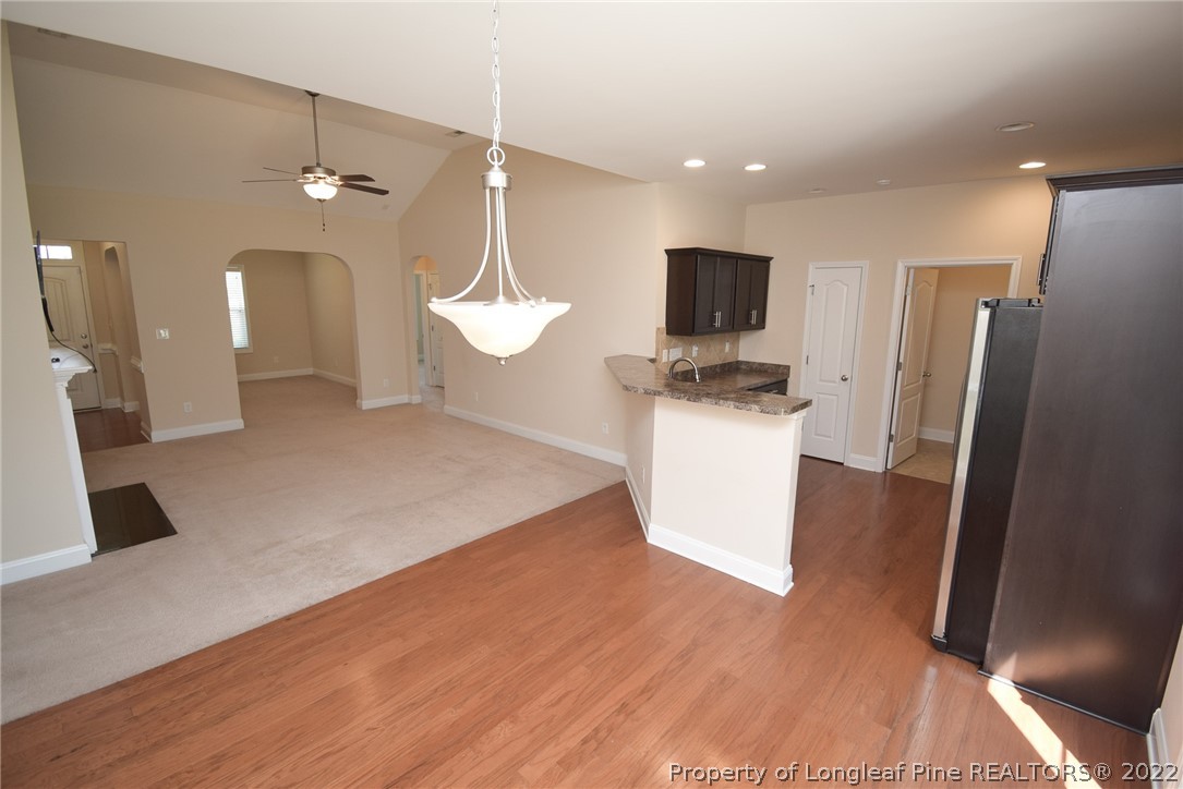 115 Snipe Court Raeford, NC 28376 - Photo 23 of 37 a view of a kitchen with a sink and a refrigerator