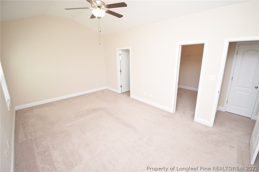 115 Snipe Court Raeford, NC 28376 - Photo 26 of 37 an empty room with a ceiling fan