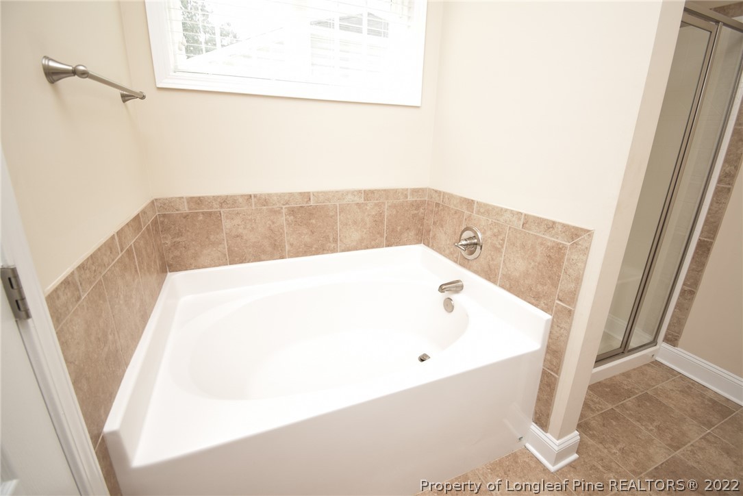 115 Snipe Court Raeford, NC 28376 - Photo 30 of 37 a bathroom with a bathtub and shower