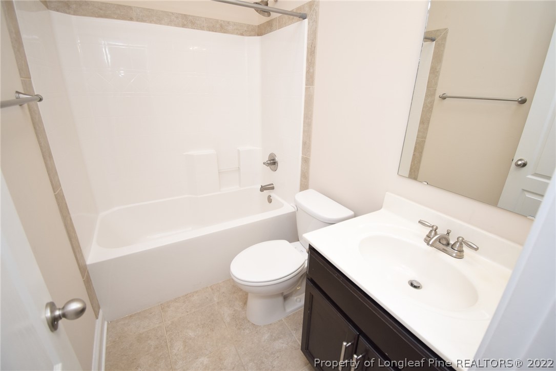 115 Snipe Court Raeford, NC 28376 - Photo 33 of 37 a bathroom with a sink a toilet and shower