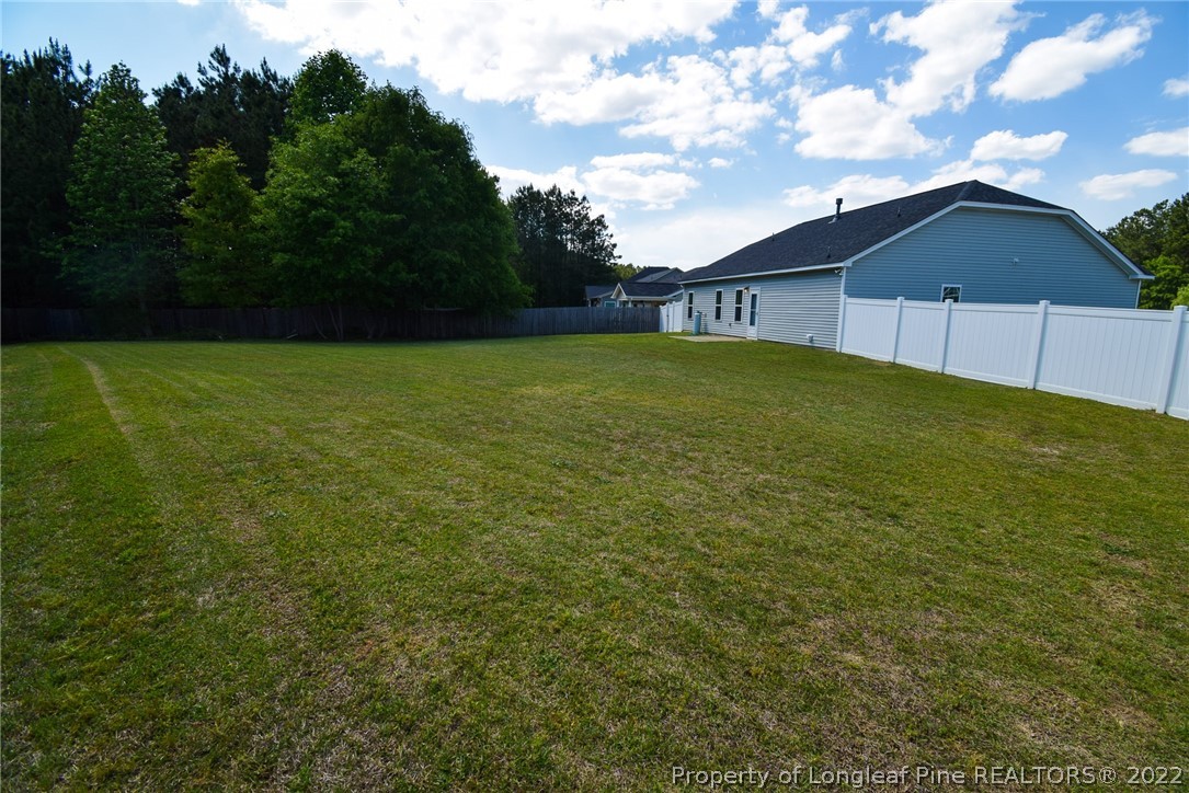 115 Snipe Court Raeford, NC 28376 - Photo 36 of 37 a view of house with backyard and entertaining space