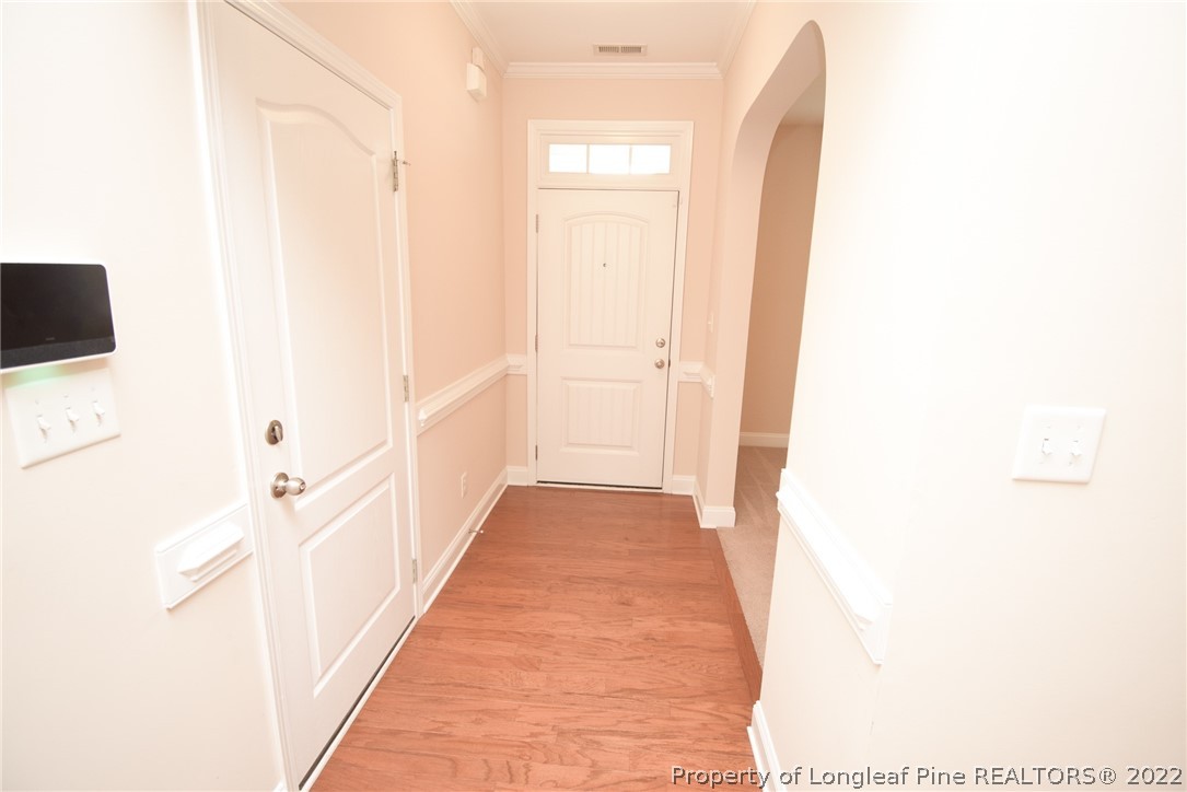 115 Snipe Court Raeford, NC 28376 - Photo 4 of 37 a view of a hallway with wooden floor