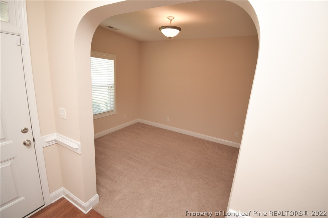 115 Snipe Court Raeford, NC 28376 - Photo 5 of 37 a view of a room with wooden floor and windows