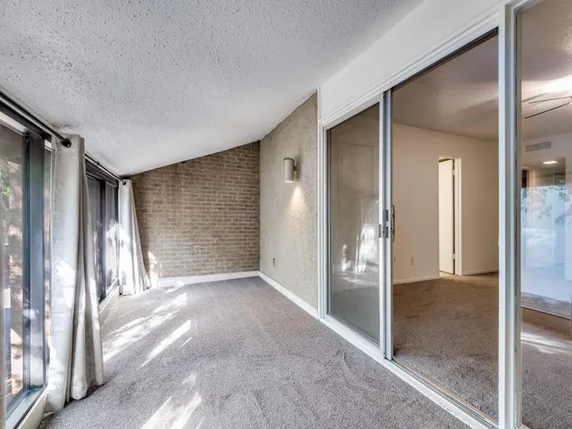 an empty room and glass door with glass door