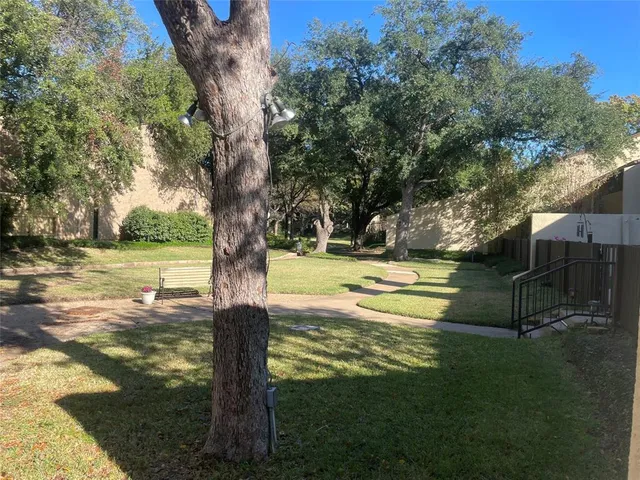 a view of a swimming pool with a yard